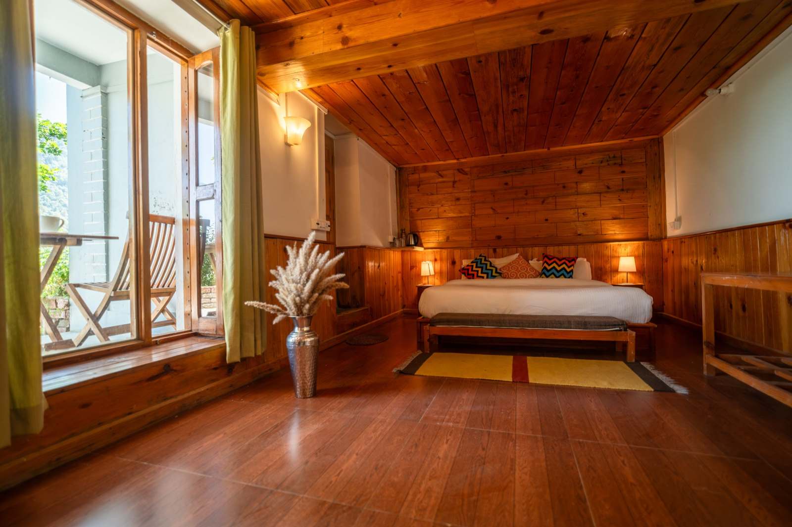Vanam heritage room with pine panelling and verandah doors
