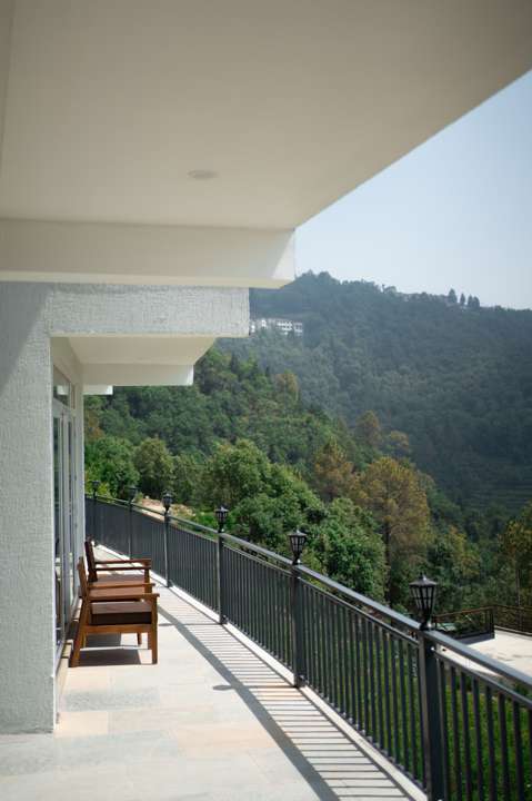 Long balcony overlooking forested hills