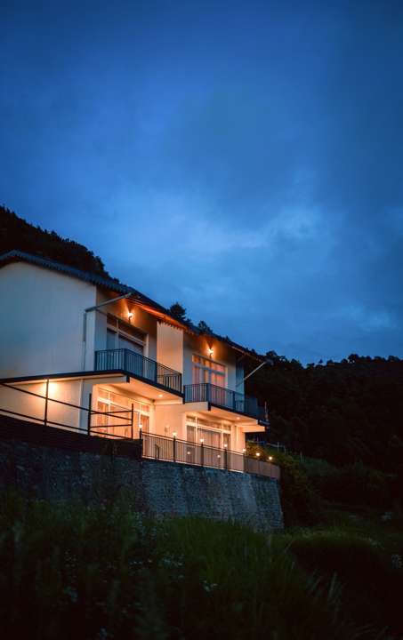 Vilasita wing lit up at dusk on the hillside